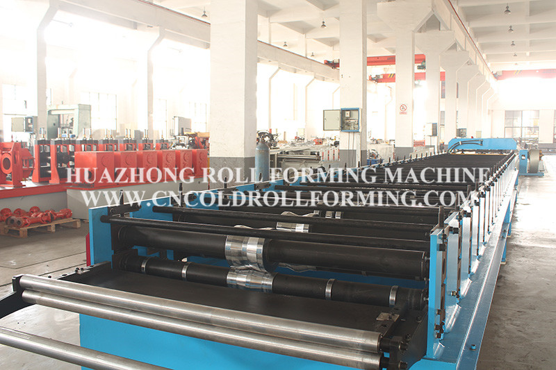 Metal cladding forming machine